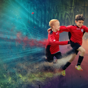 Two boys playing at a UK football tour